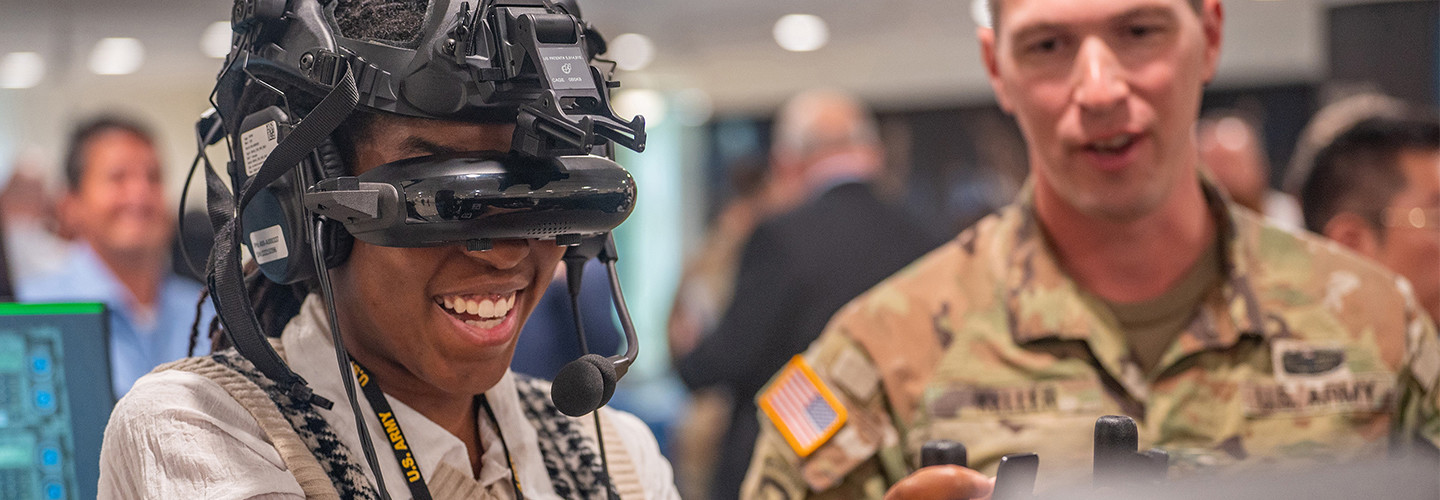 Army intern tries on a virtual reality headset