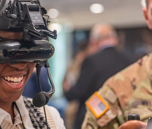 Army intern tries on a virtual reality headset