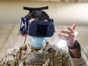 An Air Force serviceman uses an AR/VR headset