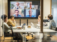 Business people attending a hybrid presentation