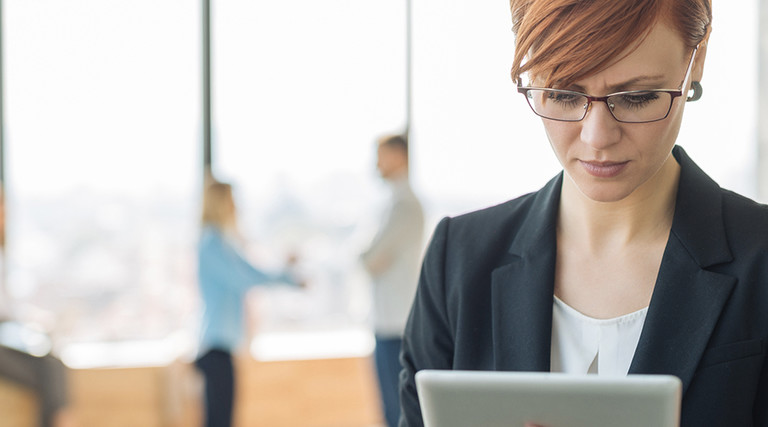 Person working on tablet in the office