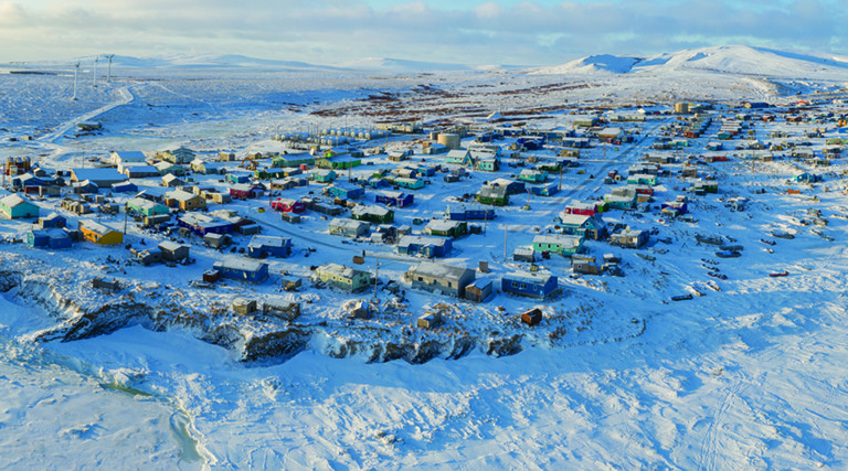 Aerial view of tiny Alaska village in the snow